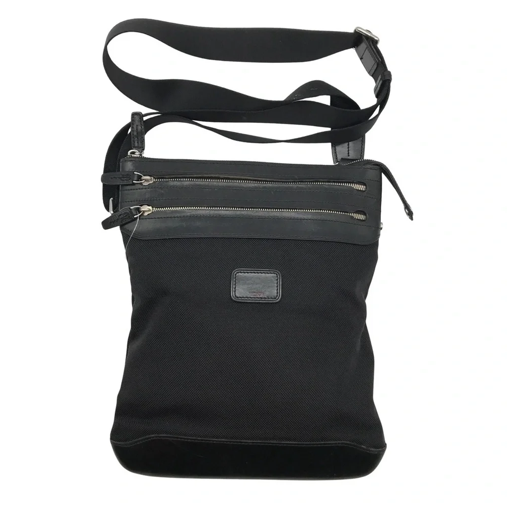 Tumi Black Messenger Bag with Silver Accents. Excellent condition